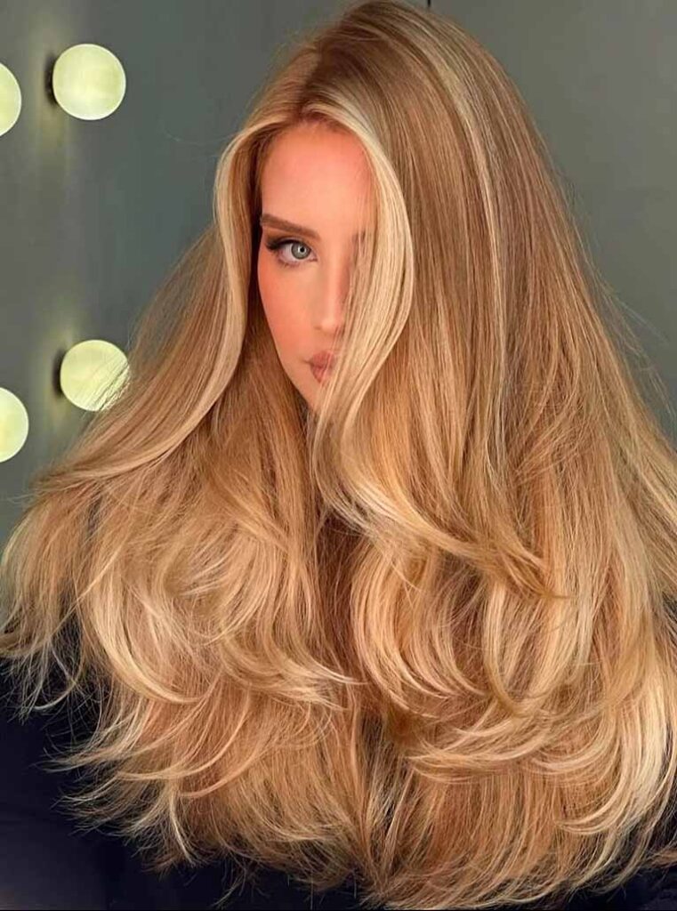 Woman with long styled blonde hair